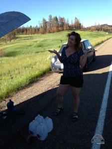 Shuffling jugs of water to re-fill the coolant. 