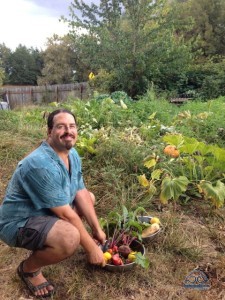 Chris basking in the glow of freshly picked produce!