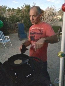 Paul grilling the homemade tortillas.