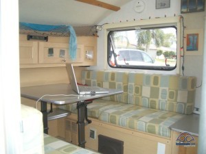 Our first RV 'office' - using the dinette that also converted to our bed. Totally unsustainable. 