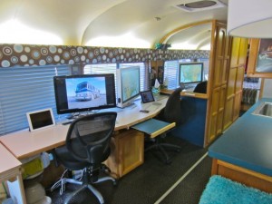 Our desk full of iDevices.