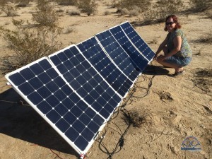 An external solar array can be deployed tilted towards the sun while you park your rig in the shade. But it is going to take a lot more than the 600 watts here to keep an AC going!